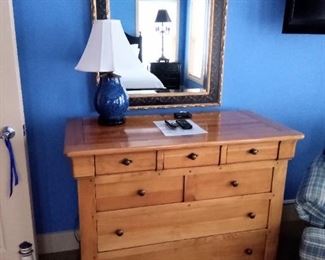 Large gold and black mirror
Wood dresser
Small Lamp