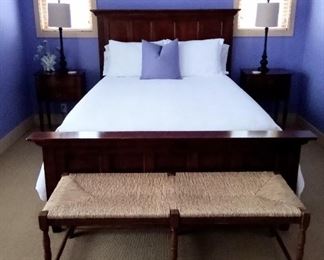 Dark wood queen bed 
(Bedding sold separately)
Cane and wood bench
Pair of end tables
Pair of tall lamps 
