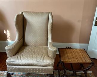 Upholstered armchair, rattan side table