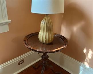 Circular occasional table and ceramic lamp