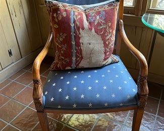 Pair of blue upholstered chairs with star pattern, mythological pillow
