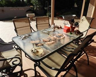 Patio glass top table with 6 chairs