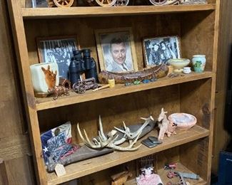 Several shelves are for sale along with Western decor, antlers and horns.