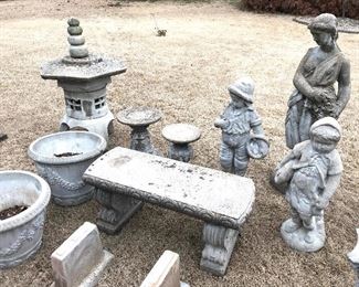 Large concrete bench, pots, and statues 