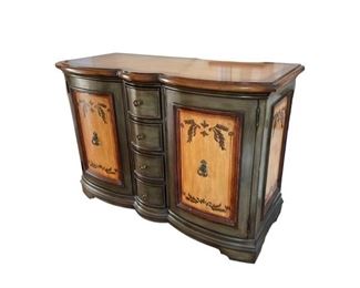 $300.00 USD     Hand Painted Sideboard KG136-12     Description:  The sideboard features four drawers flanked by 2 large doored cabinets. The piece is hand-painted and distressed in rich shades of a blue grey, brown and earthy yellow. Lovely paintings accent the doors. Finished with aged hardware.
Condition: Very good condition
Dimensions: 22 x 52 x 36"H
Local pick up Ashburn VA.  Contact us for shipper suggestions.     https://goodbyhello.com/products/hand-painted-sideboard-kg136-12?_pos=1&_sid=b468ba53d&_ss=r