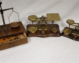 Antique brass scales with weights.