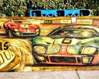 Large hand-painted wooden Le Mans race scene.