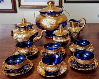 Stunning hand-decorated Bohemian blue glass with gold highlights tea set.