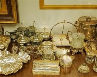 Tons of silver plate & pewter service pieces.