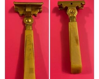A Schick razor with Bakelite handle.
