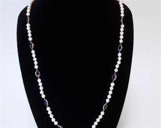 1006	CULTURED FRESHWATER PEARL NECKLACE W/ TEN GENUINE OVAL CUT AMETHYSTS. NECKLACE APP 35 IN LONG

