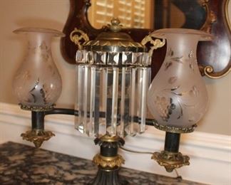 Presell @ $2498
Patinated doubled arm bronze Armand lamp with gold washed accents and original etched glass shades. Newer prisms. Electrified. Attributed to Aimee Argand. Circa 1820
Dimensions: 17”H x 19”H
Stock #006