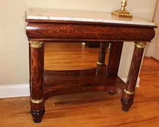 Presell - $8998
Empire American Mahogany Marble Top Pier Table w/ original glass, Giltwood accents capital and base of columns with melon feet. Circa 1820 
Dimensions: 36”H x 42”W x 16 1/2 “D
Stock #017