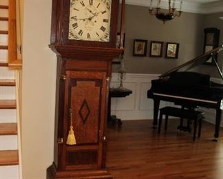 Presell @ $7998
Tall Case clock singed “Ja. Frazer and Comber”, mahogany inlay, swan neck pediment, half-moon painting of mounted General and floral painted face, reeded hood columns, Roman numerals, Arabic outer, cut steel hands. Brass finial. Circa 1790
Dimensions:90”H x 20”W x 9 1/2”D
Stock #011