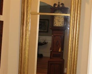 Presell @ $3998
Empire Gilded divided looking glass. Cartouche decorations on each corner. Attributed to Philadelphia. Circa 1820 
Dimensions: 57”H x 28”W
Stock #012