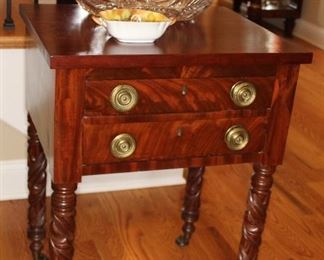 Presell @ $1998
Mahogany Two Drawer Worktable - brass keyhole escutcheons, period brass pulls, four finely all-over carved acanthus leaf pattern legs, resting on casters. Philadelphia. Circa 1820
Dimensions: 39”H x 21”W  x 21”D
Stock #028