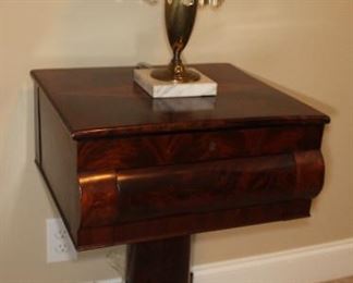 Presell @ $2998
American Empire Mahogany Worktable - overhanging lift top with diamond inlay, fitted writing desk in the interior, one ogee shaped drawer, pedestal base ending in four splayed legs and paw feet. Circa 1840
Dimensions: 29”H x 18”W x 15”D
Stock #033