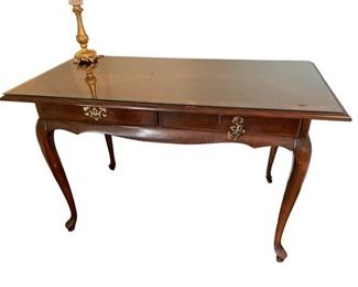 $150     
Vintage Mahogany Queen Anne Style Desk CD131-56
Description: Traditional Writing Desk. Lend an air of class to your workspace with this desk. 
Condition: Hardware is loose.
Dimensions: 50 x 25 x 30"H
Local pick up Leesburg, VA.  Contact us for shipper suggestions.     https://goodbyhello.com/products/desk-cd131-56?_pos=41&_sid=81d502833&_ss=r