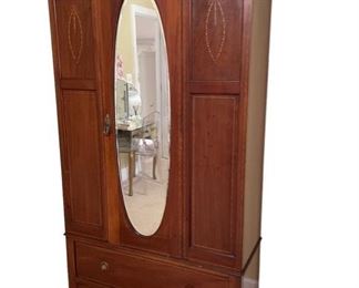 $1400    Antique Mahogany English Linen Press Mirrored Armoire w Ribbon Inlay DG145-8      Description:   Beautiful early Mahogany Linen Press/Armoire with inlay panels, large oval mirror, single bottom drawer, and working door lock. Original, unaltered finish. Interior has brass hooks and bar. The piece comes apart in 3 sections allowing easy movement.
Condition: Very good.  Missing one pull but we have it
Dimensions: 42 x 16 x 78"H
Local pick up Rockville, MD.  Located on the second floor.  Contact us for shipper suggestions.     https://goodbyhello.com/products/antique-mirrored-armoire-dg145-8?_pos=9&_sid=393e46d62&_ss=r