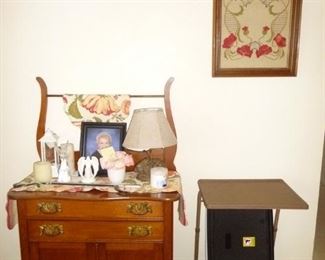 Commode  / lots of  framed linens