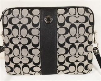 	COACH BLACK SIGNATURE IPAD OR FILE PURSE. APPROXIMATLEY 11 IN X 8 3/4 IN
