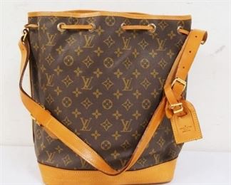 1004	LOUIS VUITTON MARKED BUCKET BAG. SOME STAINING ON BOTTOM. UNKOWN IF AUTHENTIC. APPROXIMATELY 16 IN L X 14 IN H X 7 IN
