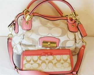 1025	COACH SIGNATURE BAG WITH PINK TRIM AND MATCHING WALLET. APPROXIMATELY 11 IN L X 8 IN H X 4 IN
