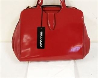 1036	CROMIA RUBINO PATENT LEATHER BAG WITH DUST COVER, NEW WITH TAGS. APPROXIMATELY 11 1/2 IN L X 10 IN H X 5 1/2 IN
