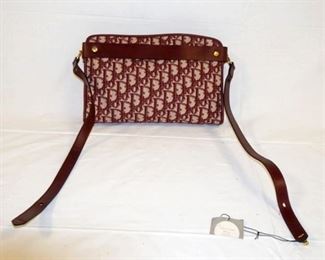 1060	CHRISTIAN DIOR SIGNATURE BAG WITH TAGS, MISSING 1 SCREW GROMMET, APPROXIMATELY 12 IN L X 8 1/2 IN X 1 1/2 IN
