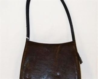 1068	GUCCI BROWN LEATHER BAG SOLD BY VANI USA INC. APPROXIMATELY 10 1/2 IN L X 9 IN H X 2 IN
