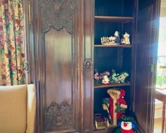 Antique 7.5’ hand-carved armoire. Three adjustable shelves, and working lock with key.