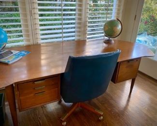 Large, mid-century modern desk used by bank president (details available at sale). Four drawers.