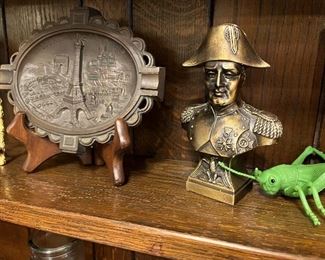 small metal bust and plaque