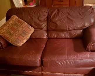 Leather love seat. Some cat scratches but no tears. Super comfortable.