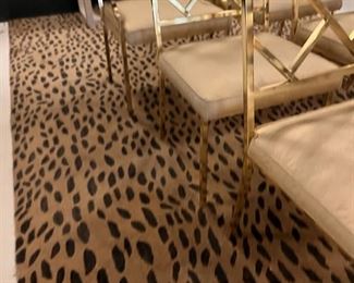 Leopard print rug 8 by 10. Brass chairs sold. 