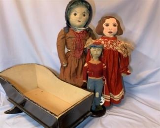 1860s cradle, Cloth stockinette doll, early knit doll, and Painted face doll. 