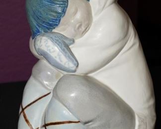 A large matte Lladro of a small Eskimo Boy.  Measures about 12" tall.