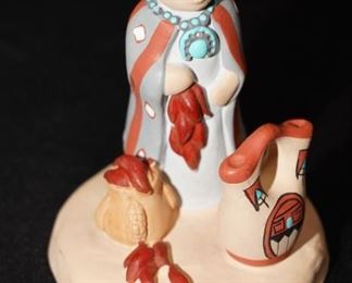 Small Native American pottery sculpture by JS.