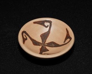 Small pottery dish by T. Youvella