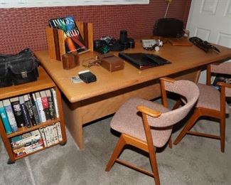 Oak desk with teak rolling storage bookcase, KS Denmark bucket chairs, inlaid teak wood book stand and several cameras and video recorders; as well as a vintage leather Mark Cross portfolio folder. 