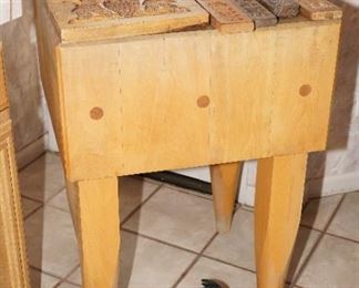 Solid wood butcher's block with vintage Dutch cookie molds, a cast iron flying pig, and a distressed dough bowl.