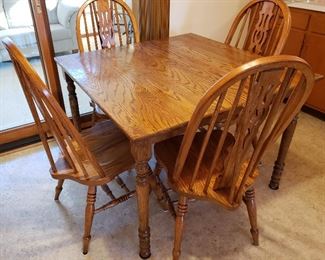 Five piece oak set has square table & hour sturdy chairs