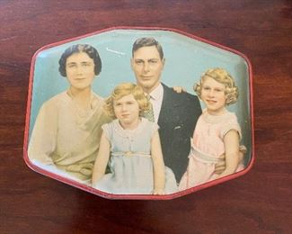 Rare trade tin of  George VI with wife, the future countess of Snowdon, and some other kid.