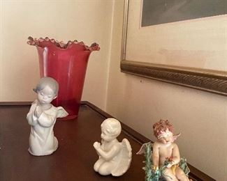 These angel figurines have been reunited with the other angel figurines on shelves of glory.
