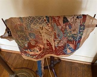 Tapestry with sewing helper device.