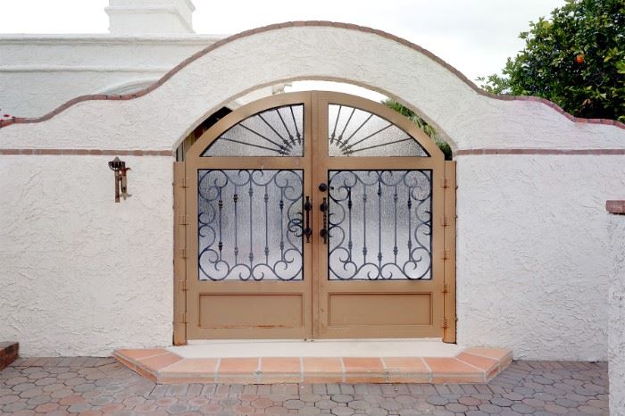 This magnificent gate is the entrance to this large Paradise Valley Spanish Style Home.