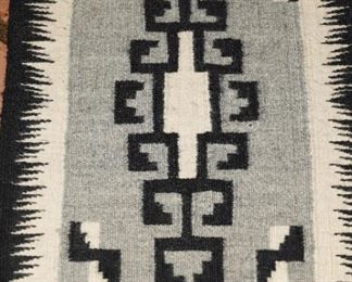 Black, gray and ivory textile by the Navajo