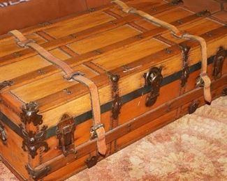 Vintage wood steamer trunk with leather straps