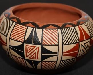 Vintage polychrome pottery vessel by Lucy C. Toledo