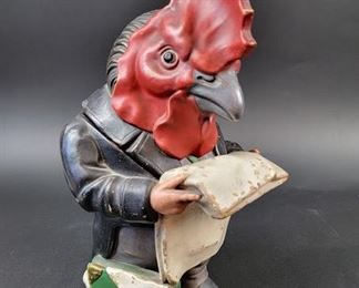 a rooster reading the paper
